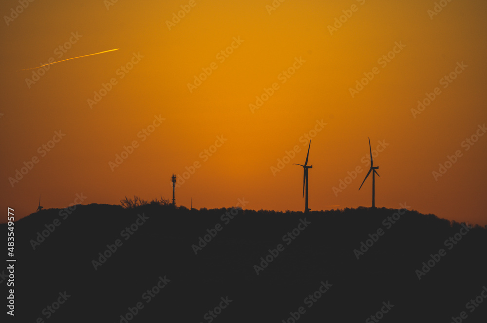Fototapeta premium wind turbines at sunset