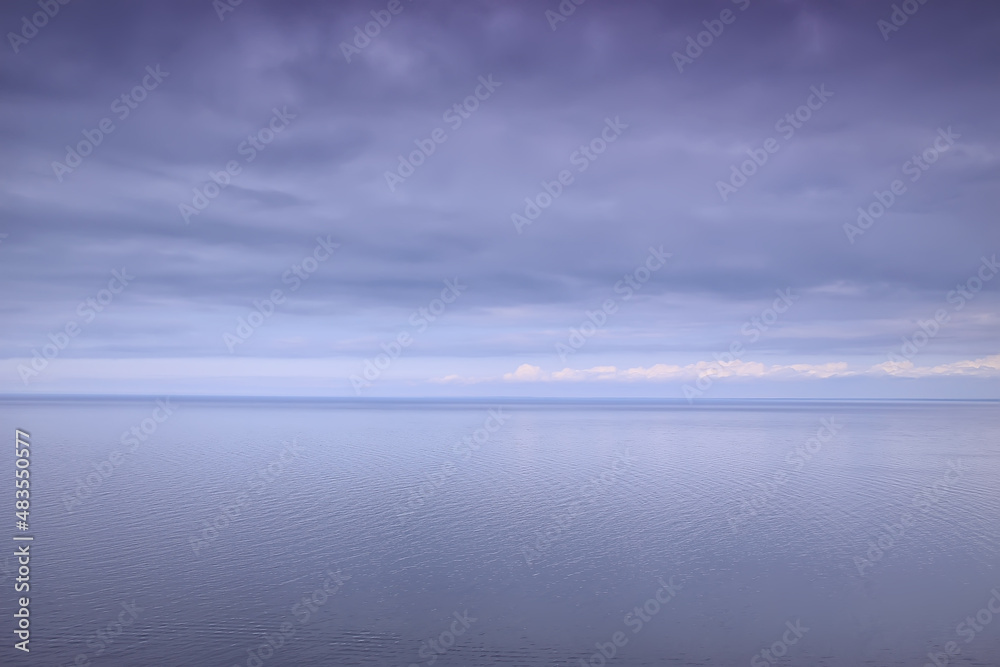 sky above water / texture background, horizon sky with clouds on the lake