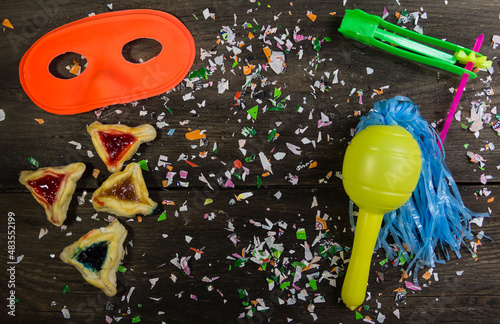 Jewish carnival concept Haman ears, masks, noisemakers, confetti photo