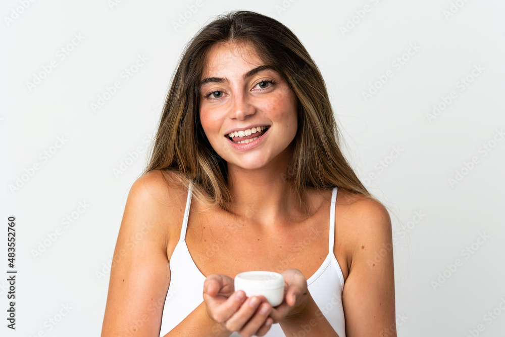 Young caucasian woman isolated on white background with moisturizer and offering it Young caucasian woman isolated on white background with moisturizer and offering it