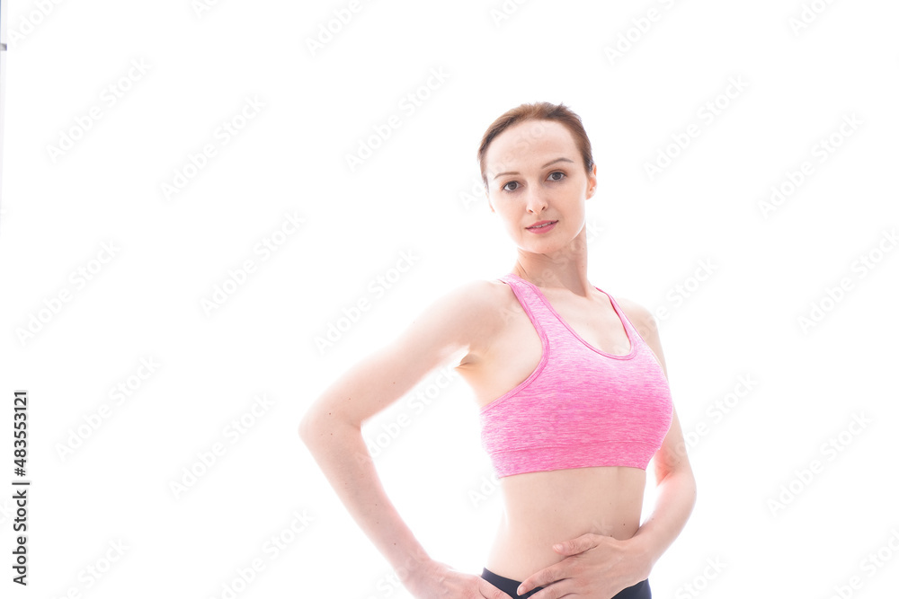 ダイエットをするスポーツウェアを着た若い女性 ダイエットをするスポーツウェアを着た若い女性