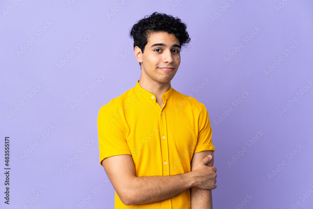 Young Venezuelan man isolated on purple background laughing Young Venezuelan man isolated on purple background laughing