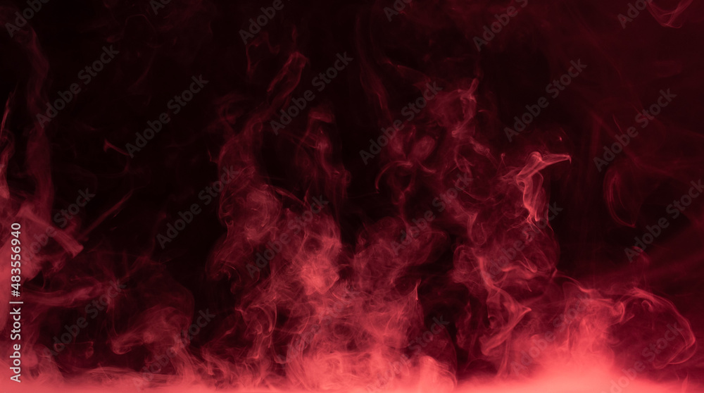 Fototapeta premium Red steam on the black background