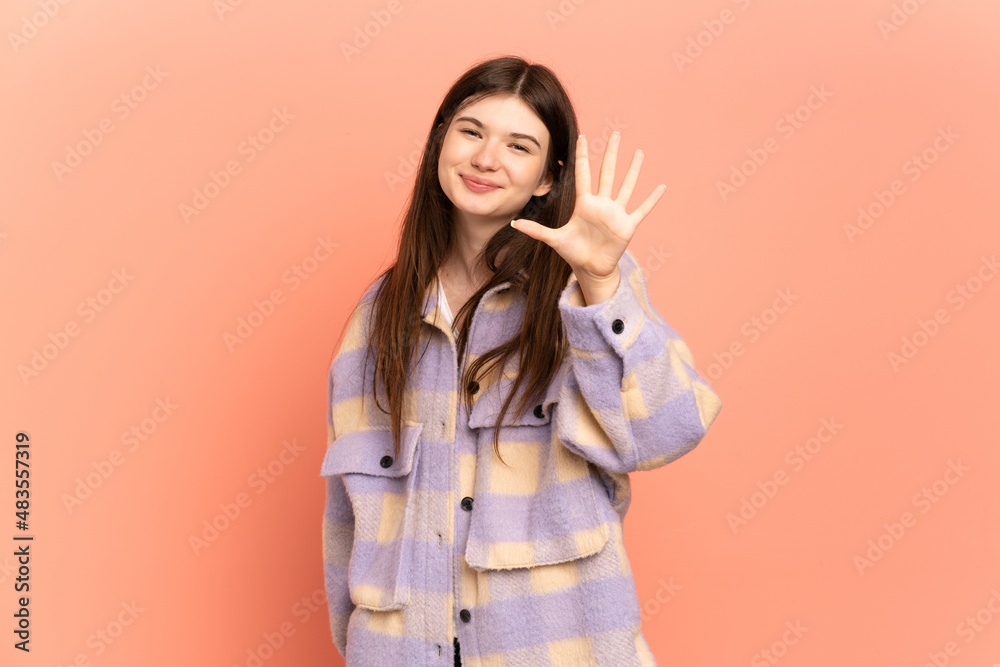 Young Ukrainian girl isolated on pink background counting five with fingers Young Ukrainian girl isolated on pink background counting five with fingers