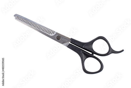 Hairdressing scissors closeup isolated on white, top view