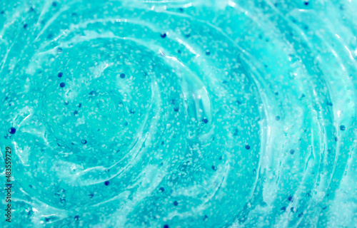 Body scrub close-up of blue color  particles of exfoliating ingredients  bubbles. Gel for cleansing the skin of the face and body. Spa treatments  skin care. kiwi seaweed goo lime green aqua