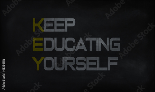 KEEP EDUCATION YOURSELF (KEY) on chalk board 