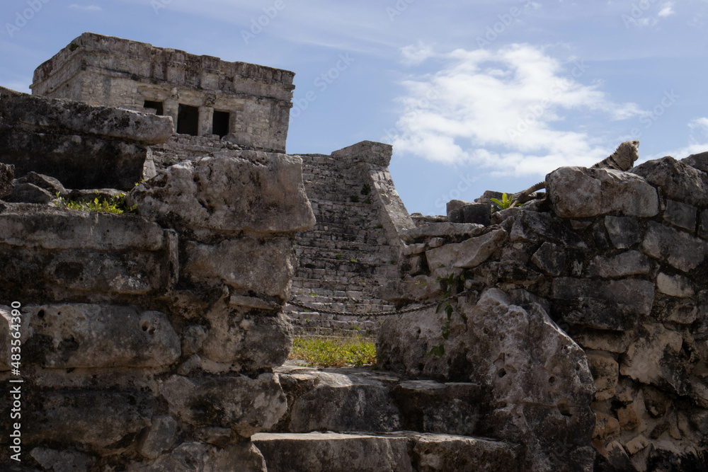 Beautiful photo of the Tulum castle, this is a mayan ruin located on the Tulum beach along the Riviera Maya being visited by many tourists on vacation in Mexico, next to the caribbean sea.