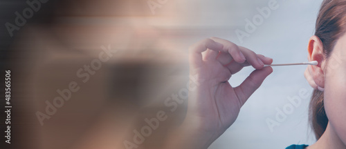 woman holding a cotton swab