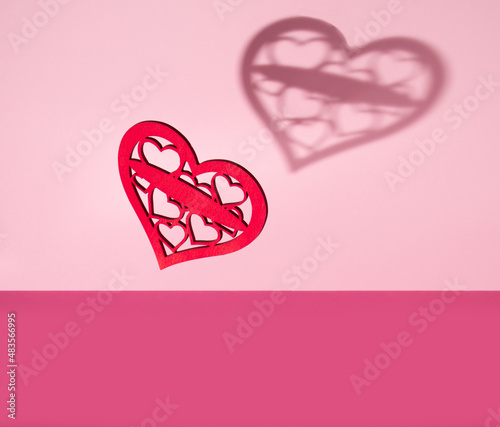 Valentine's day pink background. Minimal concept with wooden hearts. Mother day.