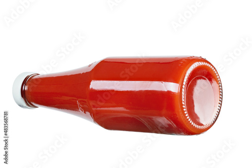 Glass bottle of ketchup on isolated white background. Tomato ketchup bottle.