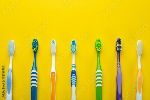 Toothbrushes on a yellow background. Health care  dental hygiene. Space for text.