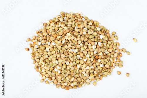Pile of buckwheat on white background. Buckwheat.