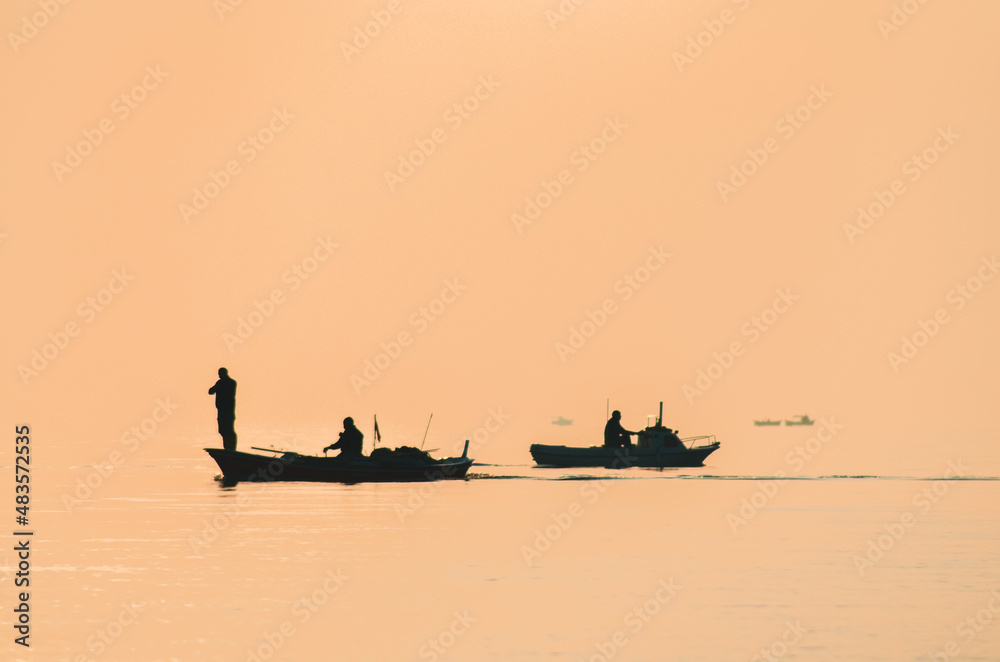 boat fisherman silhouette standing shadow