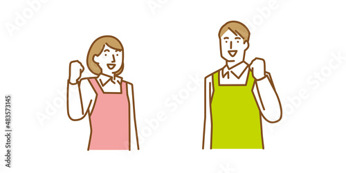 笑顔でガッツポーズをする男性と女性