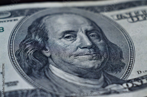 The image of Benjamin Franklin on a bill of one hundred US dollars, a macro shot
 photo