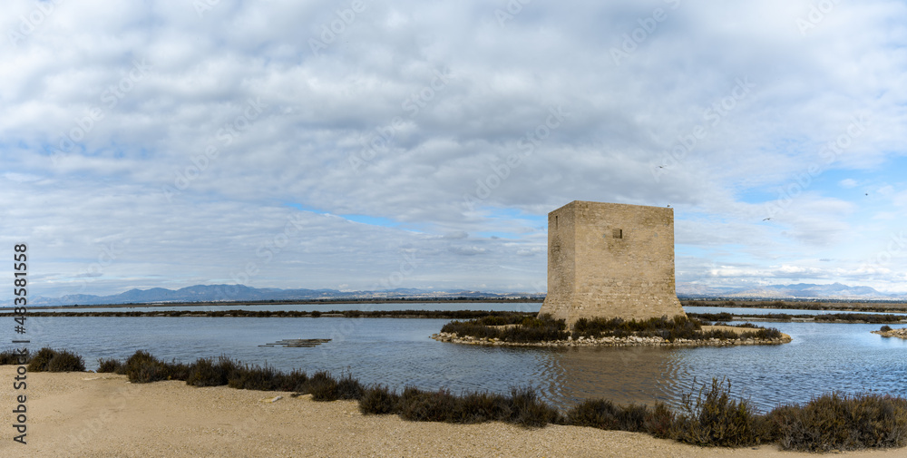 panorama view of the Santa Pola salines with a stone tower in the foreground