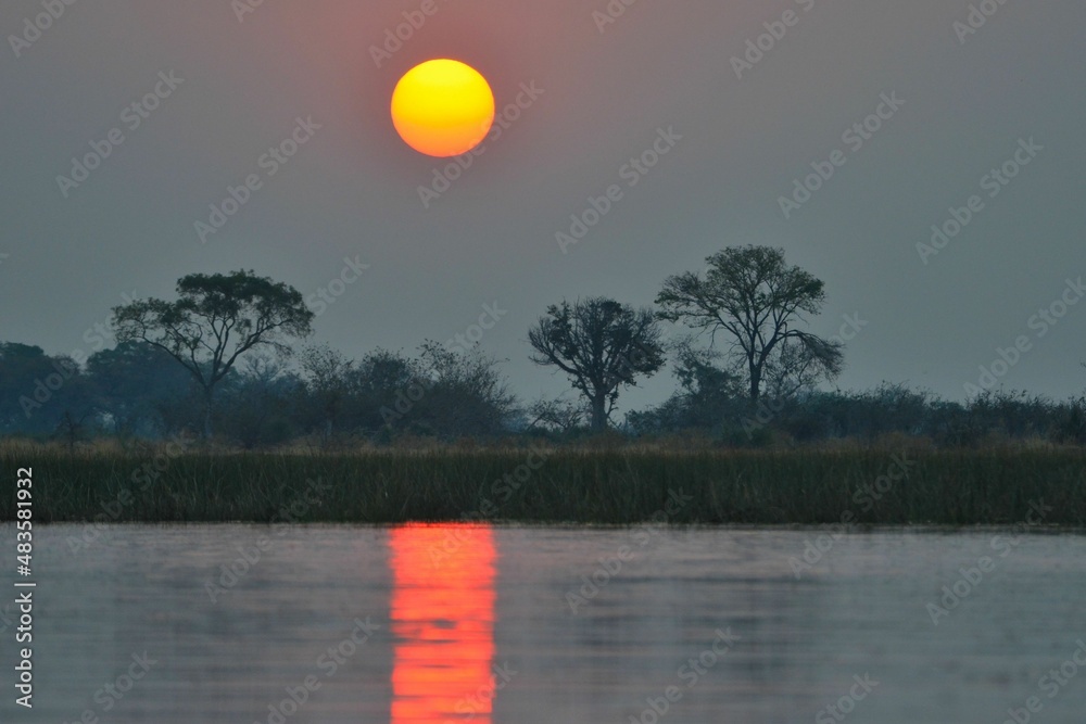 Beautiful sunset in the Okavango delta, Botswana Beautiful sunset in the Okavango delta, Botswana