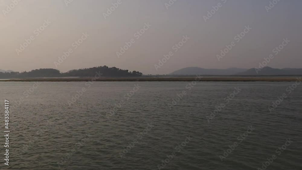 river flood flowing water with mountain background at morning river flood flowing water with mountain background at morning