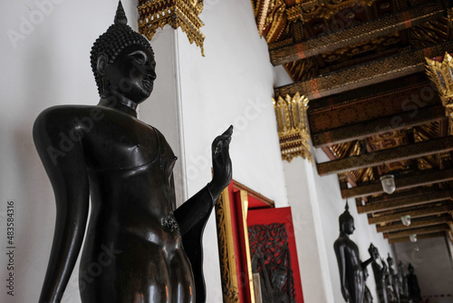 Black Buddha Statue at Wat Benchamabophit Temple in Bangkok, Thailand photo