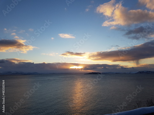 sunset over the cold arctic sea in northern Norway