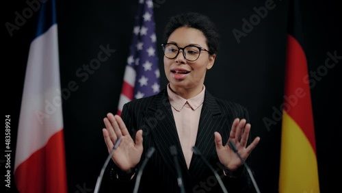 Female delegate speaking at international global issues conference, politics photo