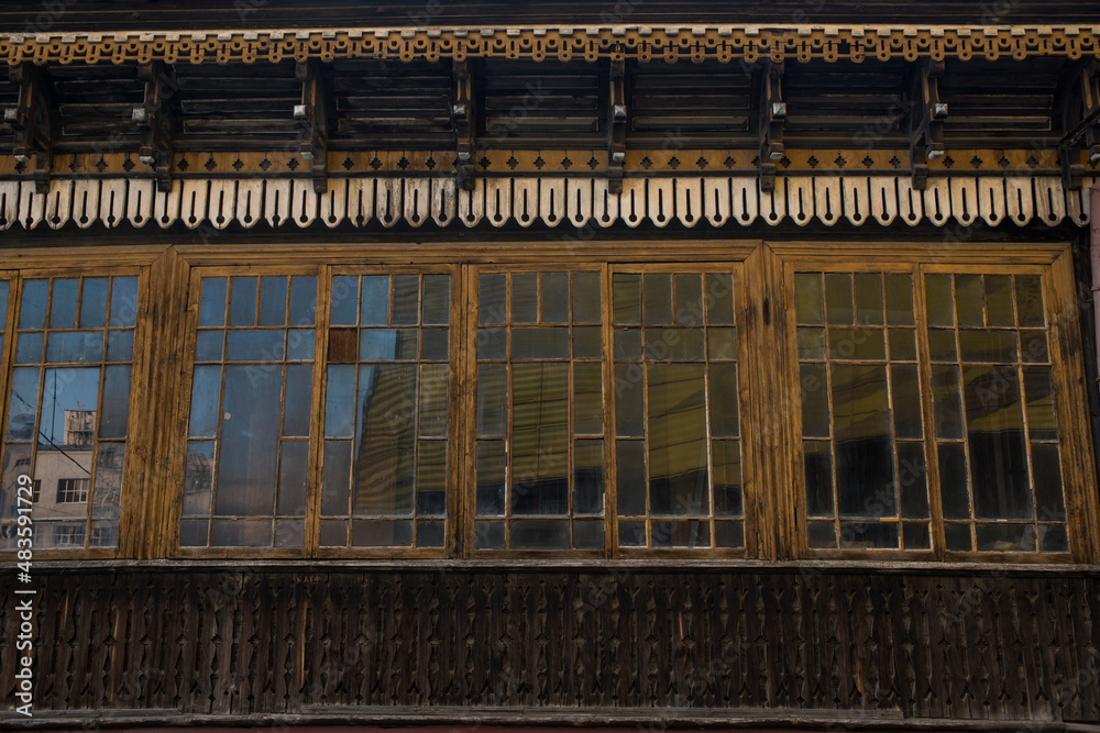 an old wooden Soviet building with mirrored windows an old wooden Soviet building with mirrored windows