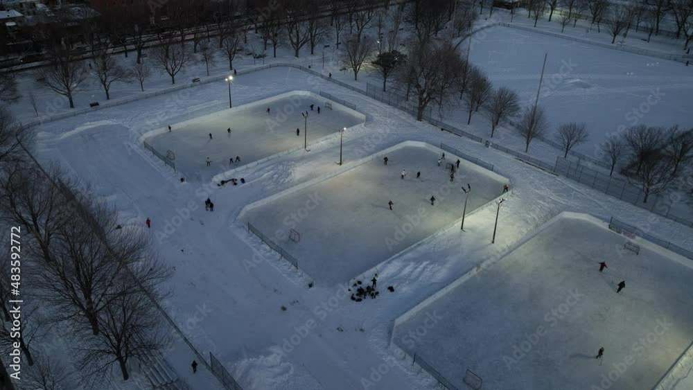 Child playing hockey game in the parc Laurier rink in Montreal