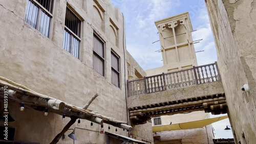 Historical Village With Traditional Wind Tower In Al Fahidi Quarter, Old Dubai UAE. Low Angle Handheld photo