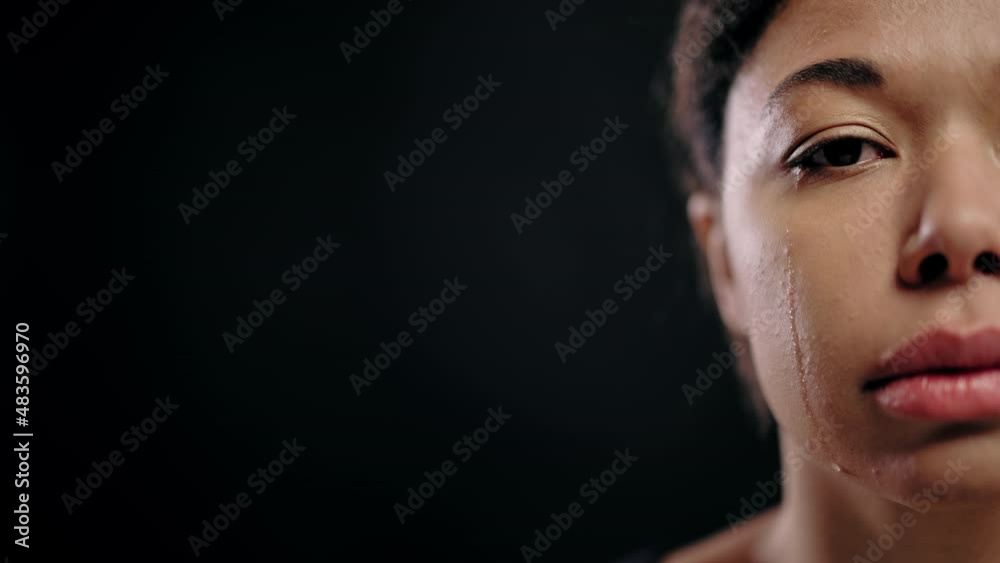 Unhappy biracial young female crying, abuse victim, stop violence against women