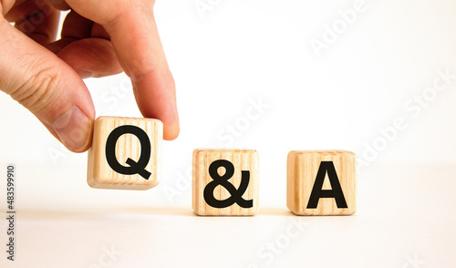 Q and A, questions and answers symbol. Concept words Q and A questions and answers on wooden cubes on a beautiful white background. Business and Q and A questions and answers concept.
