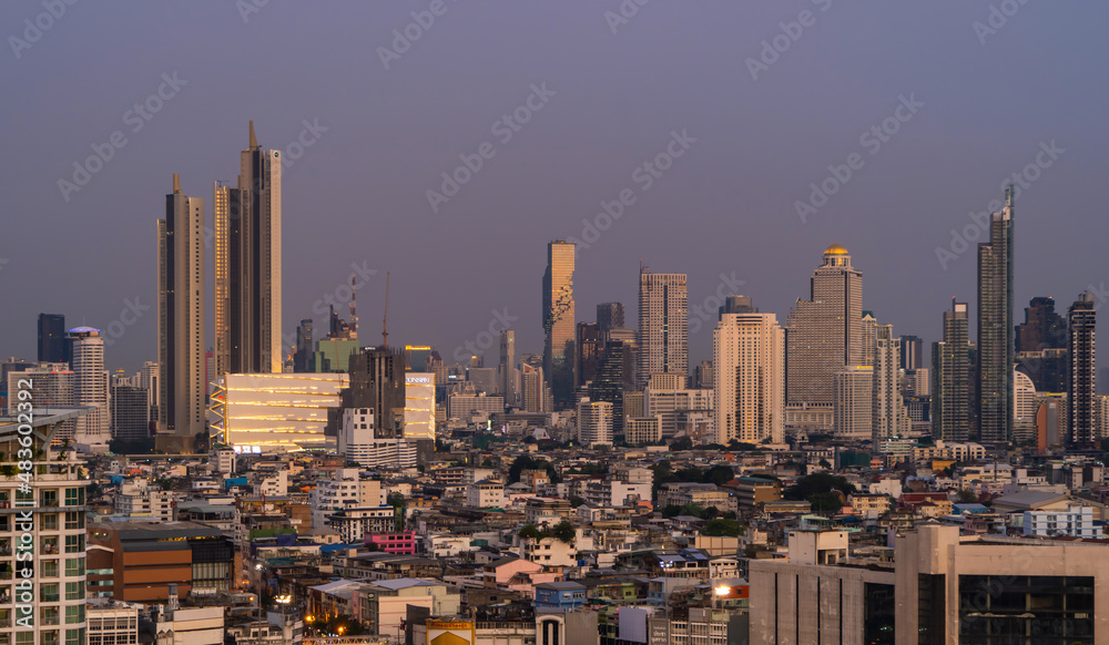 Naklejka premium Aerial view of Sathorn, Bangkok Downtown skyline. Financial district and business centers in smart urban city town in Asia. Skyscraper and high-rise buildings at night.
