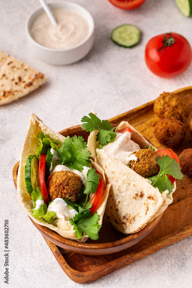 Falafel and fresh vegetables in pita bread Falafel and fresh vegetables in pita bread