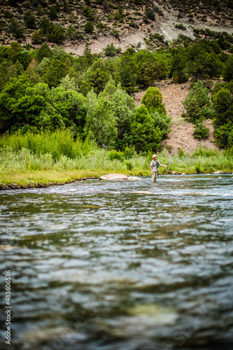 woman fly fishing in a river
