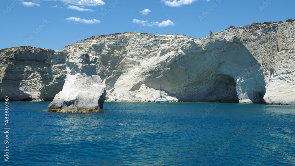 Beautiful Kleftiko, a scenic white volcanic rock formation bay visited by sail boats and yachts with emerald crystal clear sea and caves, Milos island, Greece