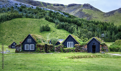 Popular Skogar village with Traditional old houses with grass on roof in Iceland. Best famouse travel area. Scenic Image of Iceland. Iceland is one most popular country for landscape photographers. photo