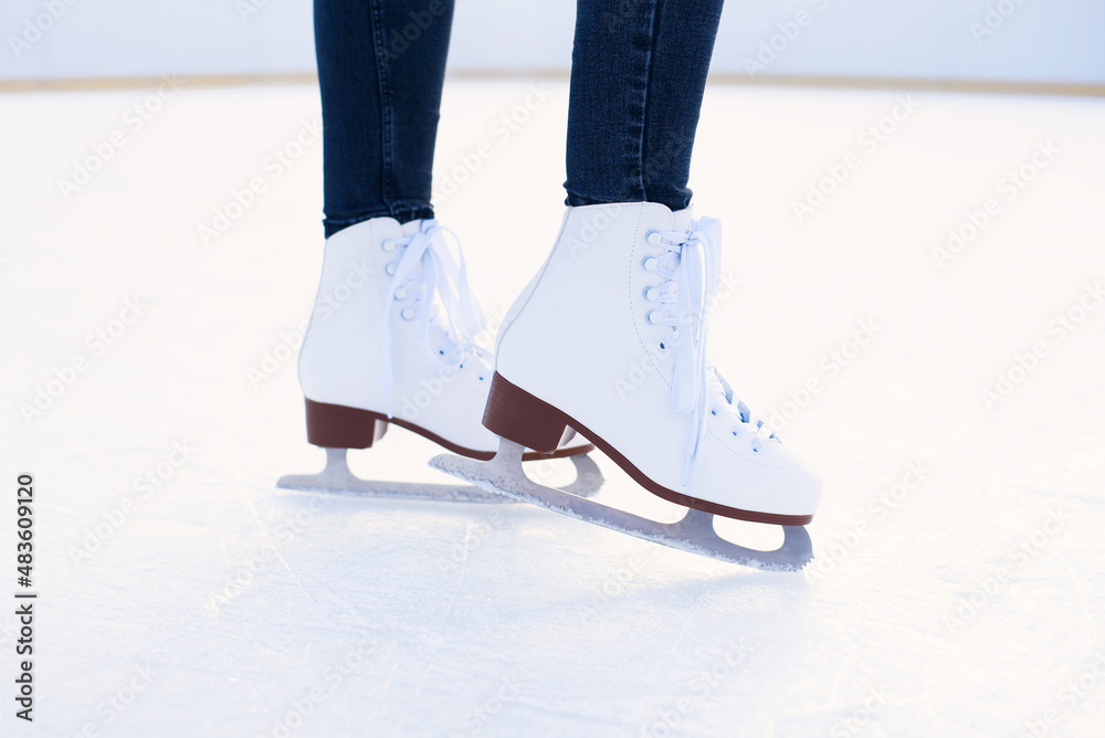 woman is ice skating on rink close up woman is ice skating on rink close up