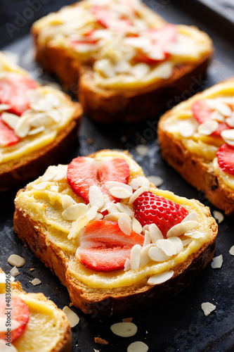 French almond toast Bostock with strawberries prepared for baking in the oven. Delicious breakfast or dessert. 