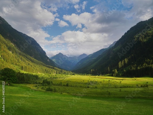 Scenic mountain landscape with beautiful valley and mountain peaks,green grass,sky with clouds.Summer landscape. Green,blue. Schladminger tauern,Alps,Austria. .