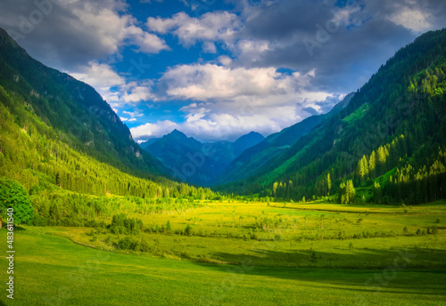 Scenic mountain landscape with beautiful valley and mountain peaks,green grass,sky with clouds.Summer landscape. Green,blue. Schladminger tauern,Alps,Austria. .