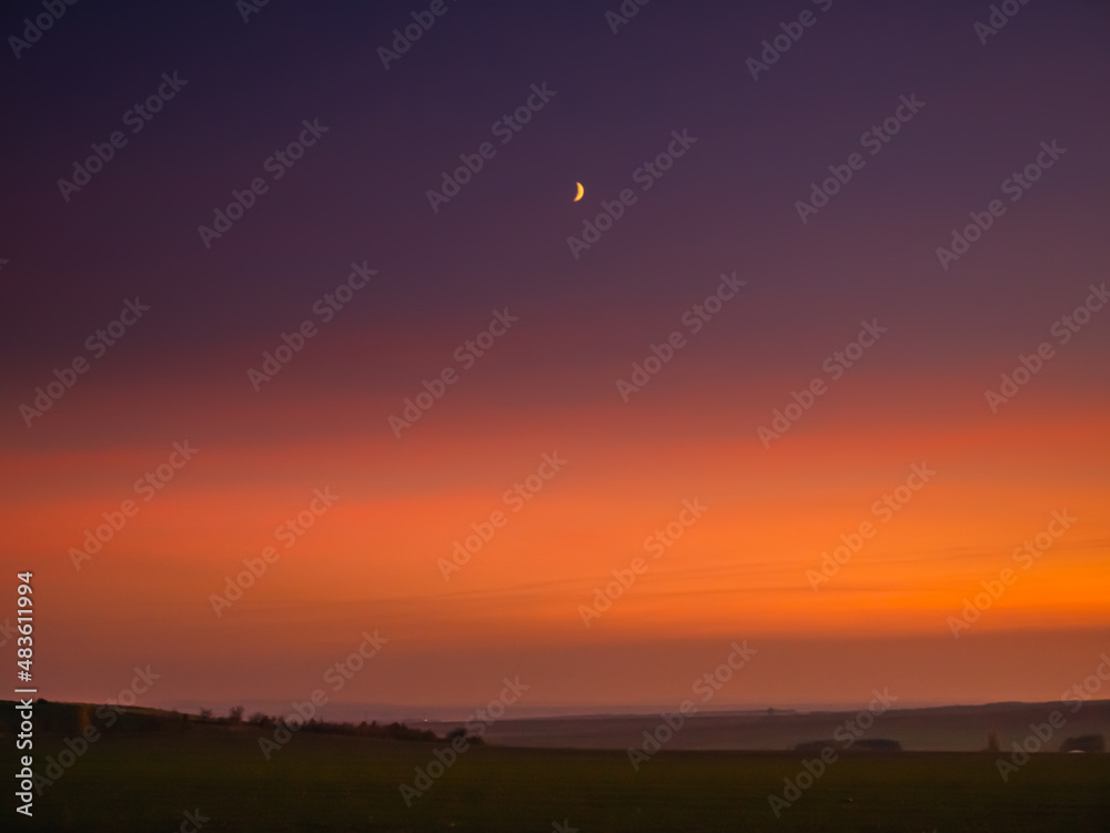 Moon on a evening sky,colour gradient, natural background.  .