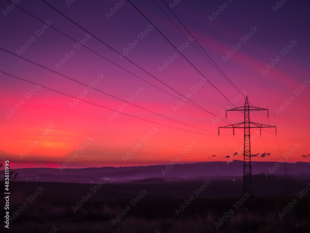 Electricity lines at dramatic sunset. .