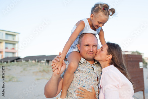 Portrait of a happy family by the sea.