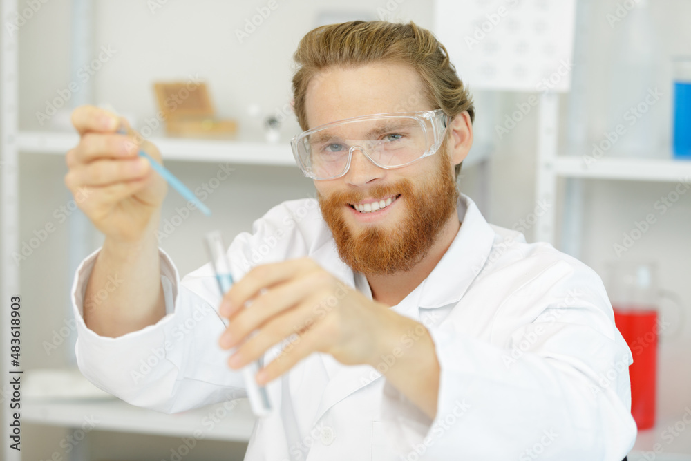 man in the laboratory while performing experiments man in the laboratory while performing experiments