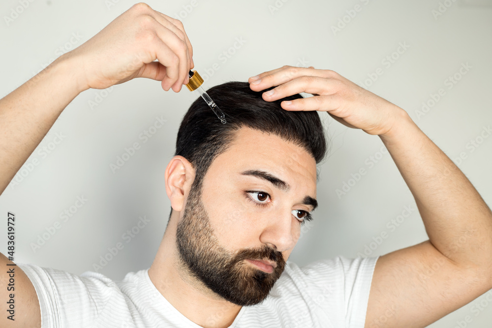 Man baldness treatment. Nature hair care procedure. Oil drop at scalp. Male person applying dermatology lotion. Home routine. trichologist cosmetic product. Anti hairloss clinic mask Man baldness treatment. Nature hair care procedure. Oil drop at scalp. Male person applying dermatology lotion. Home routine. trichologist cosmetic product. Anti hairloss clinic mask
