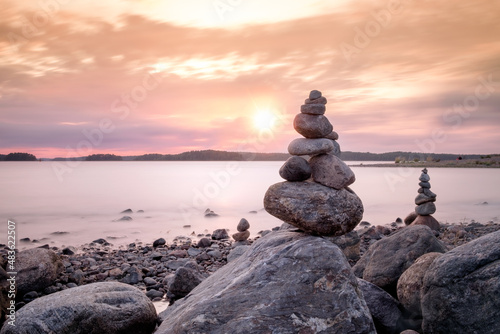 Balance stones on the beach at sunset. Zen concept  harmony and meditation.