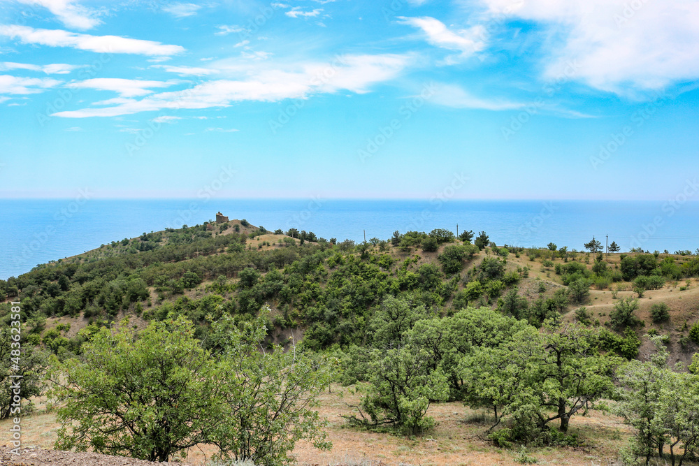 View of the Black Sea and medieval ruined tower Choban-Kule, Crimea, Russia.