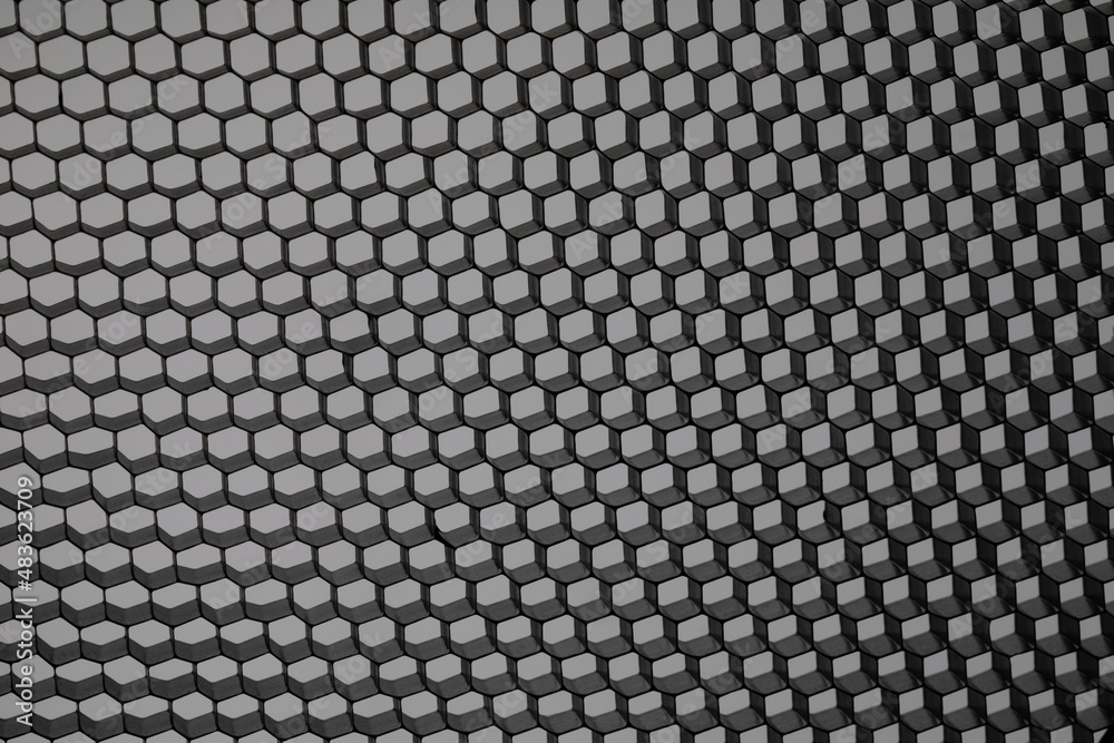 Geometric pattern of hexagons in the form of honeycombs. Metallic background.