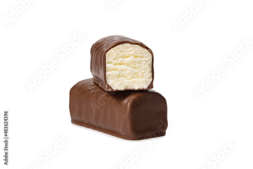 Glazed cheese in milk chocolate broken into halves on a white background