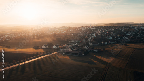 Aerial sunset view small town of Böhmenkirch, near Göppingen, Baden Württemberg, Germany